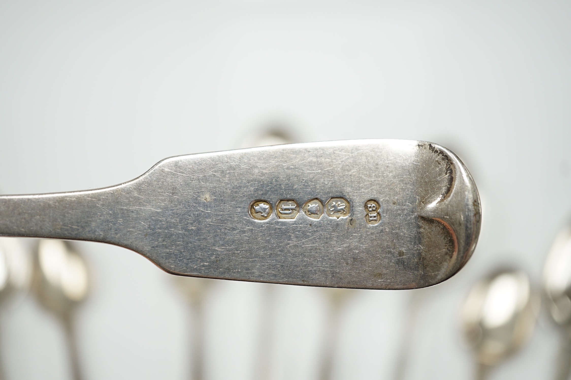 A set of six Victorian silver fiddle pattern table spoons, Samuel Hayne, London, 1863 and a set of late William IV silver King's pattern teaspoons, William Eaton, London, 1836, 21oz.